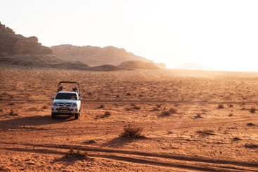 Watch the sunrise and sunset during a jeep tour in the Wadi Rum Protected Area